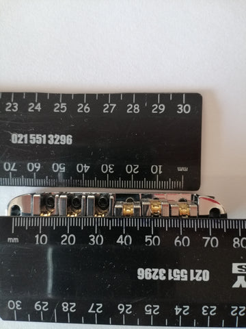 Les Paul style roller bridge Epiphone style tune-o-matic bridge . Chrome 7mm post into wood/post into bridge 4mm