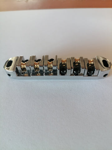 Les Paul style roller bridge Epiphone style tune-o-matic bridge . Chrome 7mm post into wood/post into bridge 4mm